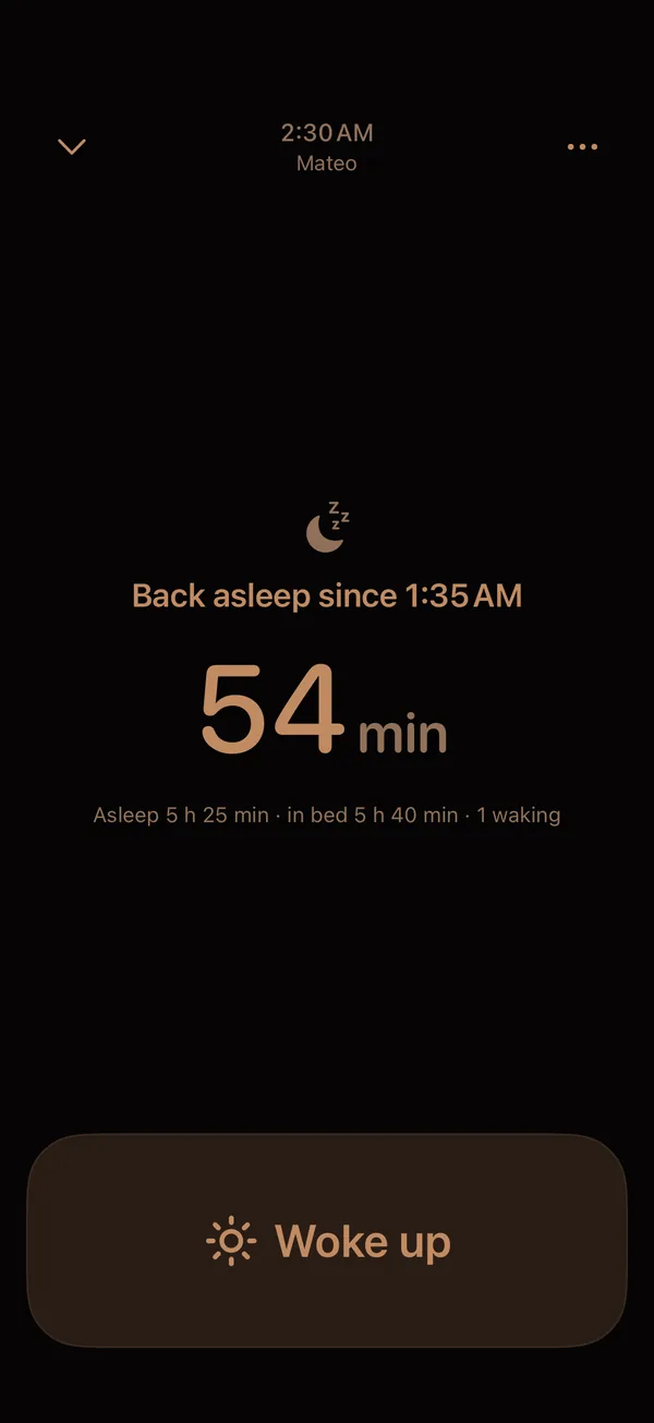 Velita night mode: a dark screen showing time back asleep and a large Woke up button
